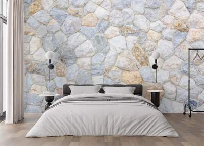 Brick stone wall stack of medieval natural stone texture background or rock strata boundary the rock seamless abstract and fragment of a walls from a gray. Wall mural