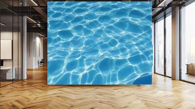 High resolution photo of a clear blue swimming pool surface, The water is calm, creating intricate patterns of light and shadow due to the sunlight reflecting off the ripples Wall mural