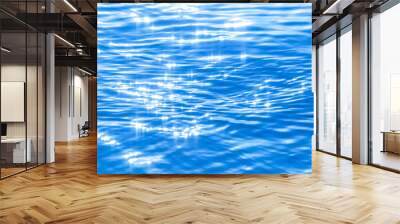 Sun light reflecting or sparkling glitter on water of sea or ocean with beautiful sky blue light tone. Wall mural