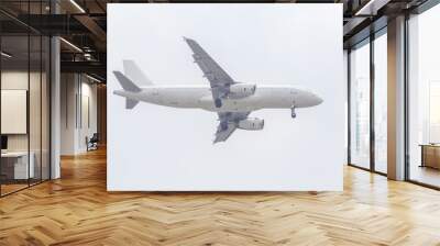 Unspecified white plane isolated on white background. Wall mural