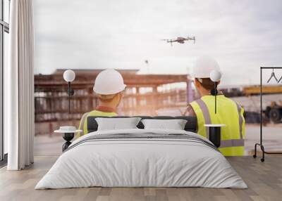 Construction concept of Engineer  working at construction Site with Drone over construction site. Wall mural