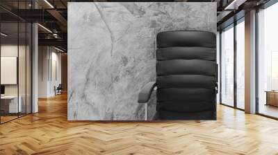 empty leather office chair on cement background Wall mural