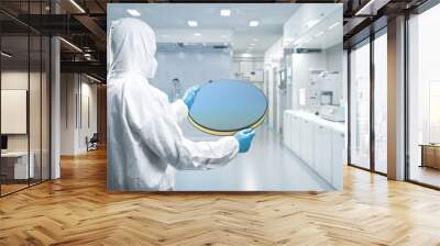 Worker or engineer wears medical protective suit or white coverall suit with silicon wafer Wall mural