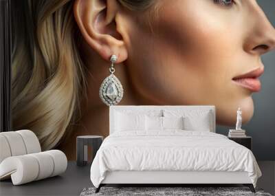 Earring with diamond. Woman with earring close up. Wall mural