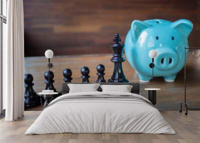 blue biggy bank and chess. Making strategy for saving money Wall mural