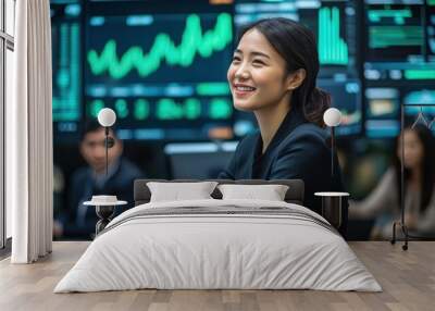 An Asian woman entrepreneur in a modern office, confidently presenting her business strategy to a group of investors, with digital screens displaying growth charts and market data Wall mural