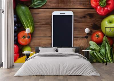 A colorful cluster of fruits and veggies stands next to the phone. Wall mural