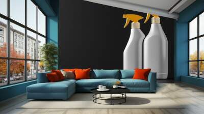 A plastic hygiene cleaning spray bottles are placed side by side on a black surface. Wall mural