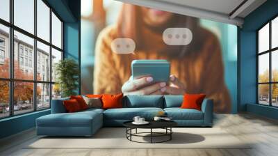 Woman holding smartphone with a blank speech wording and social network icons. Wall mural