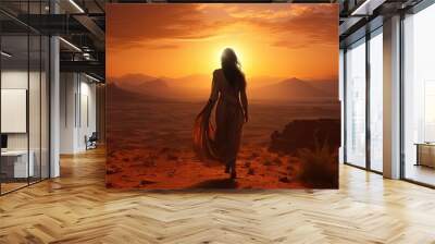 Female  woman walking in the desert at sunset Wall mural