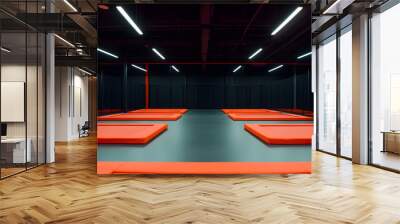 Trampoline Park with Bright Lights and Orange Trampolines | Fun-Filled Indoor Adventure and Play Wall mural