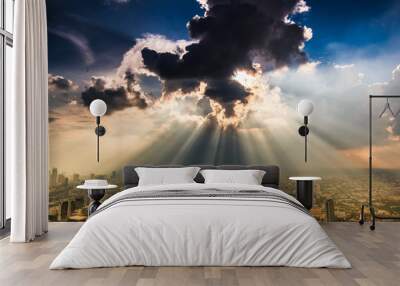 Rays of light shining through dark clouds Wall mural