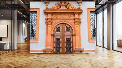 close up of intricately carved wooden door with decorative elements on historic building facade Wall mural