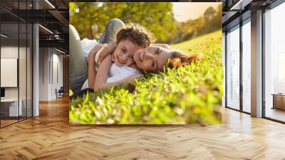 Lifestyle portrait mom and daughter in happines at the outside in the meadow Wall mural