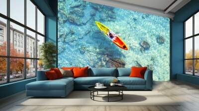 Aerial view of a kayak in the blue sea .man kayaking he does water sports activities. Wall mural