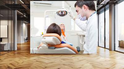 Happy young female patient visiting dentist for teeth whitening Wall mural