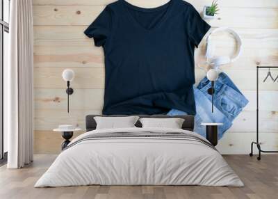 Black female t shirt mock up flat lay on wooden background. Top front view Wall mural