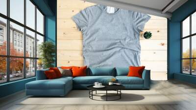 Gray male t shirt mock up flat lay on wooden background. Top front view Wall mural