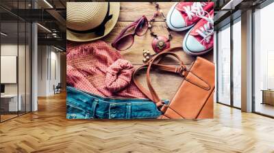 clothing for women, placed on a wooden floor. Wall mural