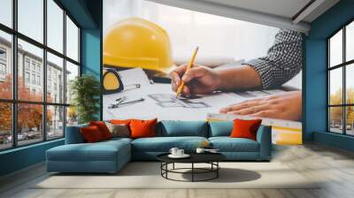 engineer working in office with blueprints, inspection in workplace for architectural plan, construction project ,Business construction. Wall mural