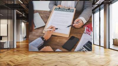 House signers signing signature loan document to home ownership with real estate agents ownership. Mortgage and real estate property investment, home insurance Wall mural