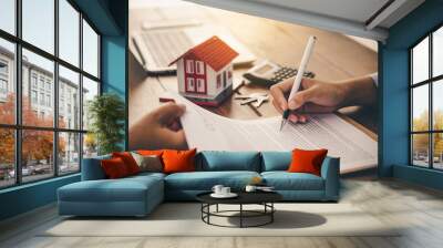 House signers signing signature loan document to home ownership with real estate agents ownership. Mortgage and real estate property investment, home insurance Wall mural