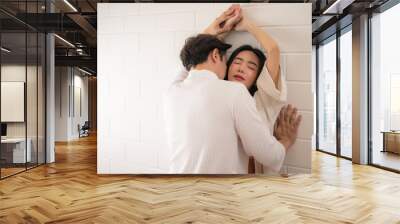 Asian young couple in underwear having sex in bedroom. Wall mural