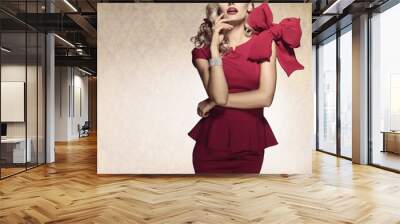 arrogant blond sexy girl. red dress Wall mural