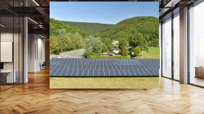 Panneaux photovoltaïques au pied du barrage en face du village de Coo en Haute Belgique Wall mural