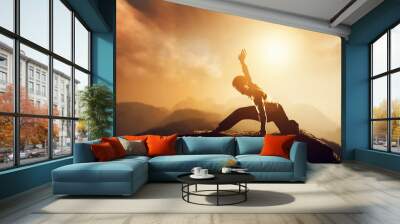 Asian man, fighter practices martial arts in mountains. Sunset Wall mural