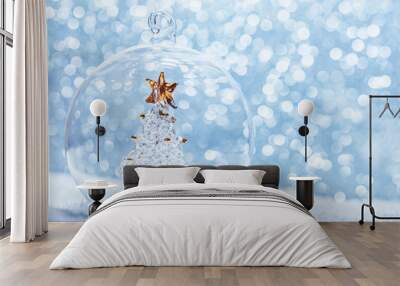 Christmas glass ball with crystal tree inside in snow Wall mural