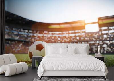 Football soccer ball on grass field on stadium Wall mural