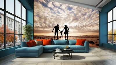 Happy family together hand in hand on the beach at sunset. Wall mural