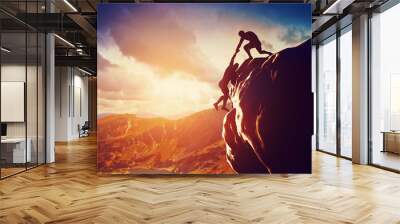 Hikers climbing on mountain. Help, risk, support, assistance Wall mural