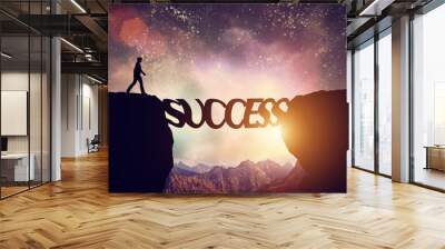 Man about to walk over precipice on SUCCESS word bridge Wall mural