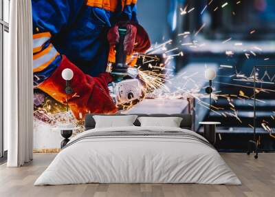 Worker grinding in a workshop. Heavy industry factory Wall mural