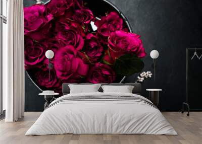 Expression of love and romance. Beautiful bouquet of red roses in a box on dark background. Burgundy flowers to show true feelings Wall mural