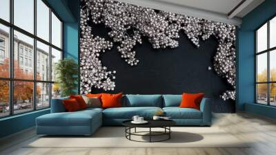 Silver beads winter decor on dark background. Festive frame design. Free space concept Wall mural