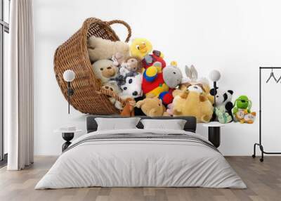 Stuffed animal toys in a basket isolated on a white background Wall mural