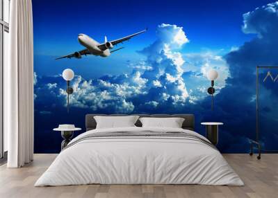 the plane passing through clouds Wall mural