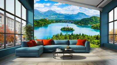 Beautiful landscape of Lake Bled the church island in the middle and the castle in the background of white clouded sky from Ojstrica viewpoint in Bled, Slovenia Wall mural