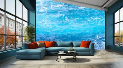 Atlantic ocean with blue water on a sunny day. Waves, foam and wake caused by cruise ship in the sea Wall mural