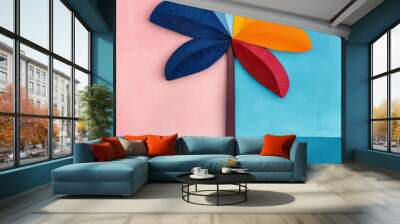 Abstract pop art style palm tree with colorful leaves on a split pink and blue background. Wall mural