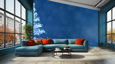 christmas time. christmas tree with stars and snowflakes in blue winter landscape. Wall mural