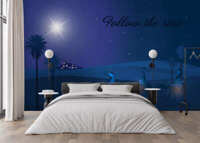 Christmas time. The three kings follow the star to Bethlehem in blue landscape. Text: Follow the star. Wall mural