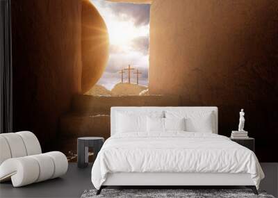 Crucifixion and Resurrection. Empty tomb of Jesus with crosses in the background. Easter or Resurrection concept. He is Risen. Happy Easter. Wall mural