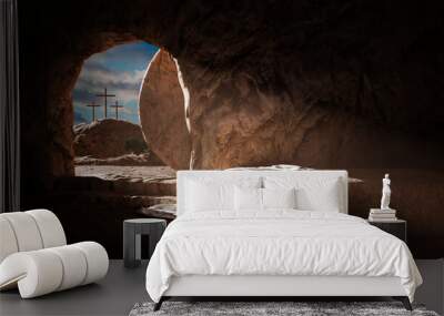 Crucifixion and Resurrection. Empty tomb of Jesus with crosses in the background. Easter or Resurrection concept. He is Risen. Wall mural