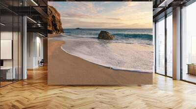 French landscape - Bretagne. A beautiful beach with wild cliffs in the background at sunset. Wall mural