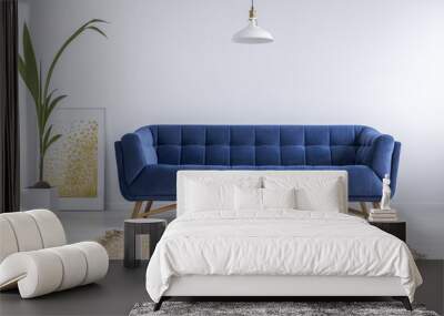 Blue sofa and wicker carpet Wall mural