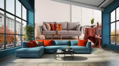 Copy space on empty white wall of fashionable living room interior with grey and orange design Wall mural